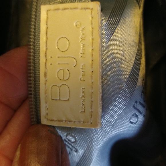 Beijo a pearlized gold color with black straps and trim. - Picture 13 of 14